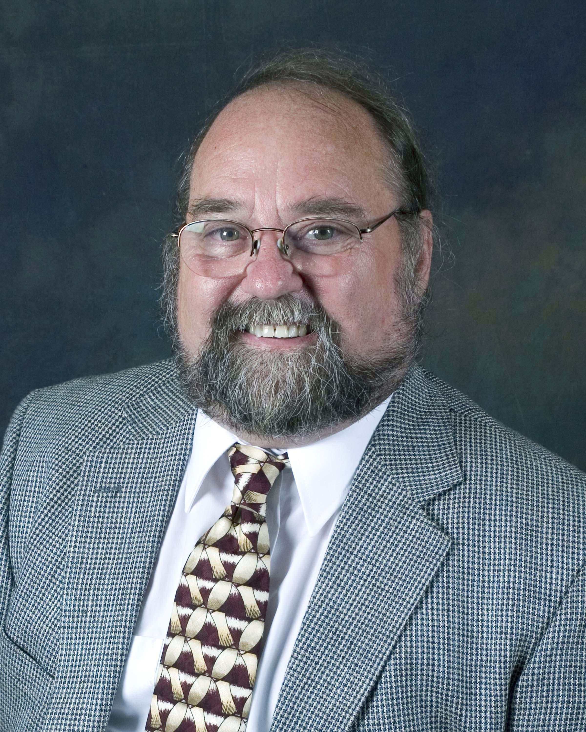 Headshot photo of George Breidenthal 